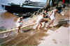 Laos - Luang Prabang - Children playing at the Mekong-River